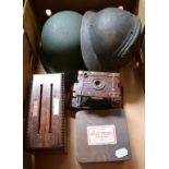 EXTRA LOT: A Kodak No 2 Hawkette bakelite camera, a letter box, marbles, and two military helmets (