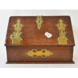 A Victorian oak stationery box, with brass mounts, 33 cm wide, an inlaid mahogany tray, an RAF tunic