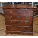A 19th century Dutch walnut chest, the shaped rectangular top above four graduated long drawers,