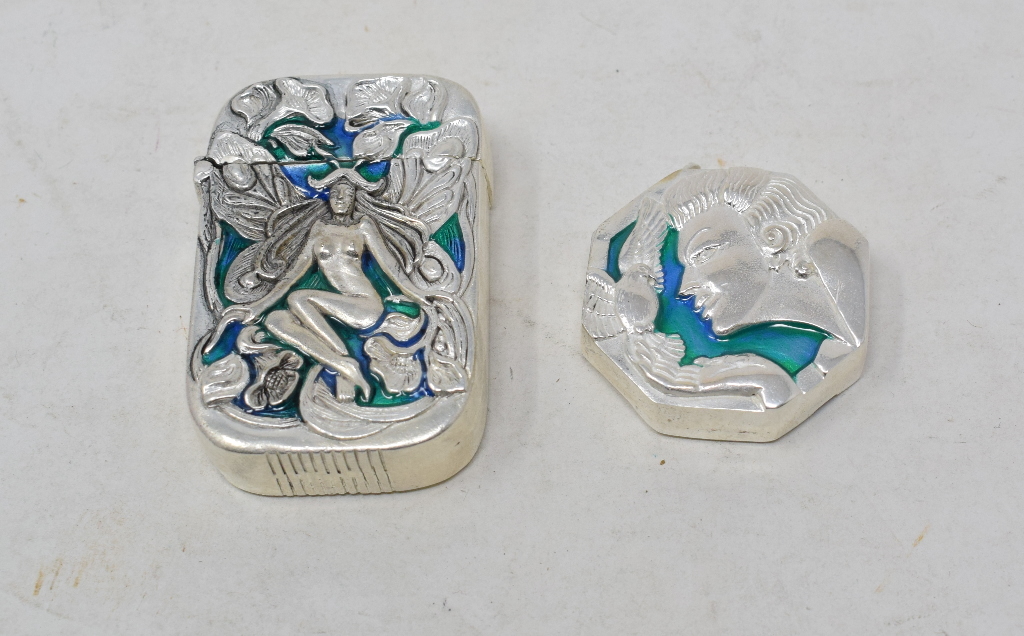 A silver plated and enamel vesta case, decorated a fairy, and another (2)