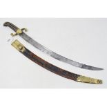 A 19th century short sword, with a curved blade, and a brass mounted scabbard, worn and with some