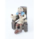 A Will Young Widecombe pottery figure, Old Uncle Tom Cobley, 8 cm high, assorted porcelain Christmas