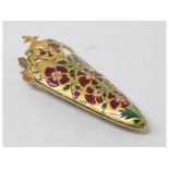 An Indian gold chape, with floral enamel decoration, in green and red, slight loss, 6.5 cm See