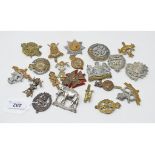 Twenty regimental cap badges