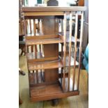 A revolving bookcase, 60 cm wide Report by GH Top badly stained and with two large square probably