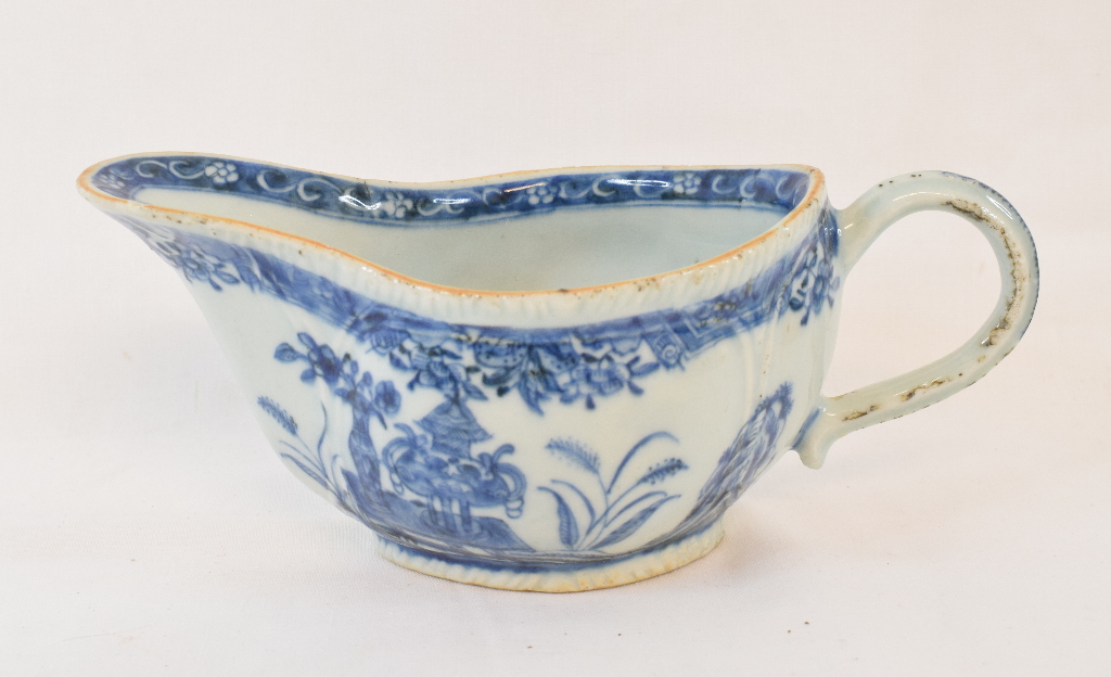 An 18th century Chinese blue and white porcelain sauce boat, decorated flowers, 20 cm wide Report by
