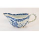 An 18th century Chinese blue and white porcelain sauce boat, decorated flowers, 20 cm wide Report by