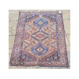 A Persian rug, 153 x 104 cm