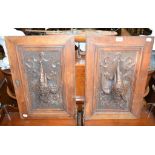 A pair of carved hardwood door panels, decorated hanging game, 40 cm wide, a fruitwood table top