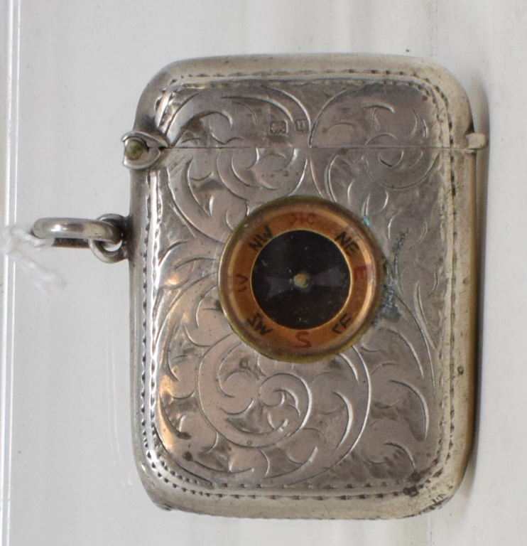 A silver vesta case, inset a compass, Birmingham 1919