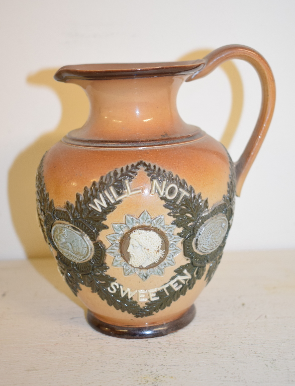 A Royal Doulton Lambeth stoneware jug, Bitter Must Be The Cup That A Smile Will Not Sweeten,