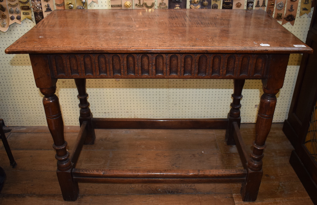 An 18th century style oak table, on turned legs, 99 cm wide