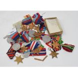 Fourteen WWII Stars, various campaigns, five Defence Medals, and other medals