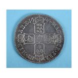 A James II shilling, 1685 See illustration Dug up in a garden about 40 years ago, some scratches/