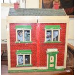 A dolls' house, with furniture, 62 cm wide