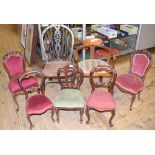 A childs kitchen wheelback chair, a similar tub armchair, and five Victorian style chairs, for dolls