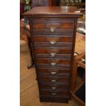 An early 20th century oak filing cabinet, with eight drawers, 42 cm wide Report by GH General wear