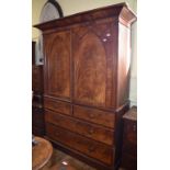 A Victorian mahogany linen press, having a pair of lancet panel doors above two short and two long