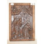 An oak panel, carved the Annunciation, 38 x 25.5 cm
