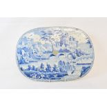 A 19th century blue transfer printed drainer, decorated a castle, 37.5 cm wide, an English blue
