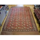 A flat weave rug, decorated lozenges on a red ground, within a multi border, 350 x 227 cm Report