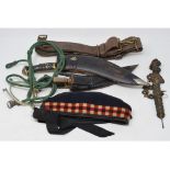 Two kukris, a pair of spurs, a Chinese coin sword, two regimental side caps, a military beret, and
