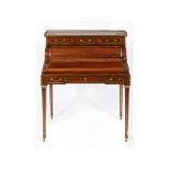 A Louis XVI style mahogany cylinder desk, the brass three quarter gallery above a marble top and
