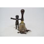 A bronze cherub, 13 cm high, another, and a hand bell (3)