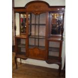 An Edwardian inlaid mahogany display cabinet, on cabriole legs with pad feet, 135 cm wide