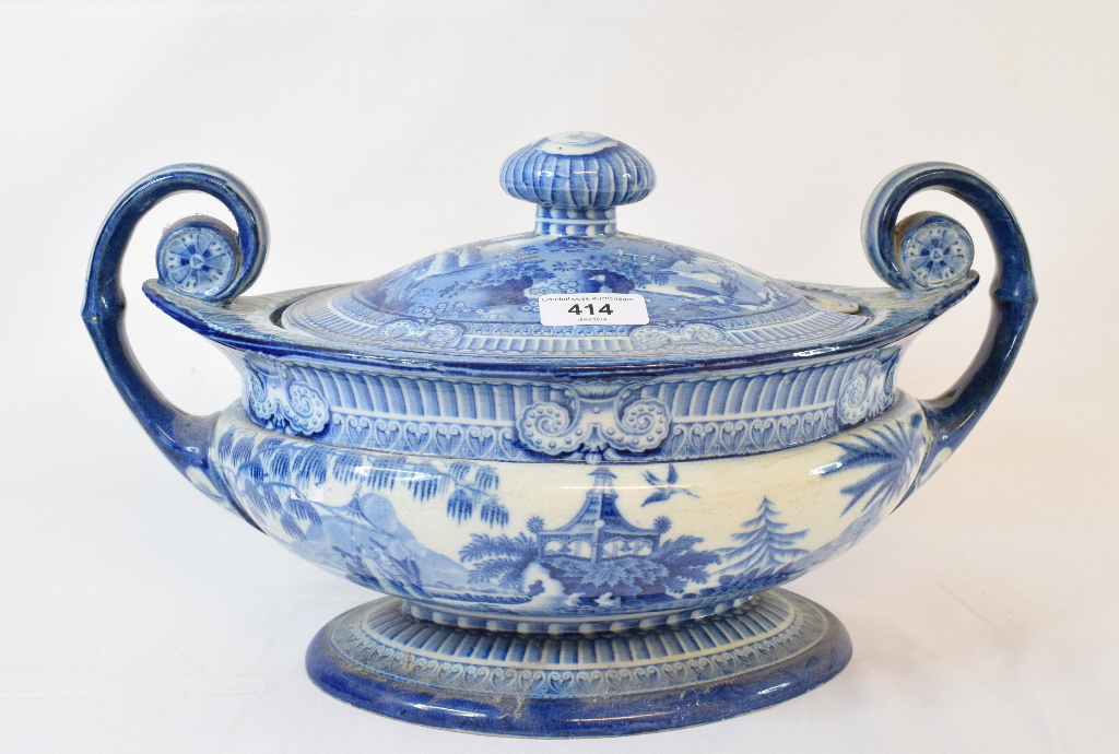 A 19th century blue and white pottery tureen and cover, with chinoiserie transfer printed