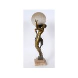 An Art Deco lamp, in the form of a figure holding an orb on her shoulder, signed Fayra, on a stepped