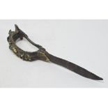 An Indian Bichawa, the handle with figural decoration, and a steel blade, 23 cm See illustration
