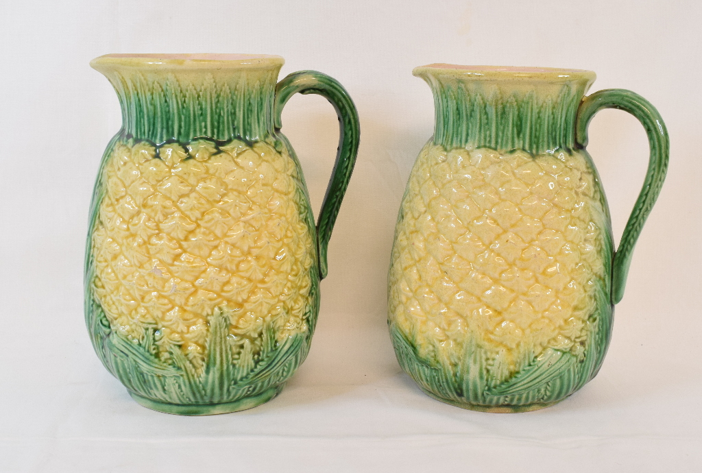 A pair of pottery jugs, in the form of pineapples, 21 cm high, a Meissen part dinner service, the