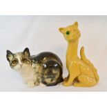 A Winstanley pottery cat, 18.5 cm high, an Aller Vale pottery winking cat, 30.5 cm high and a Falcon