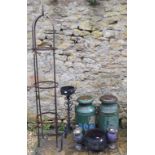 Two milk churns, 74 cm high, an iron cauldron, a garden obelisk and other items (8)
