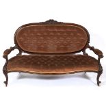 A Victorian walnut settee, carved flowers and foliage, on cabriole front legs with knurl feet See