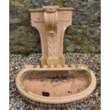 A terracotta wall fountain, 82 cm diameter