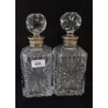 A pair of cut glass decanters, with French silver coloured metal collars, 24 cm high (2)