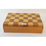 A chess set, the two piece box lid forming the chess board, 37 cm wide