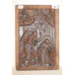 An oak panel, carved the Annunciation, 38 x 25.5 cm