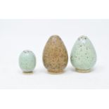 A set of three ceramic pepperettes, in the form of eggs, the largest 5 cm high (3)