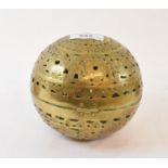 An Indian brass hand warmer, with embossed scroll decoration, 13 cm diameter, and two other items (