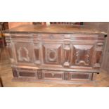 An oak mule chest, the lift up top above panels with geometric mouldings, and a drawer below, 134 cm