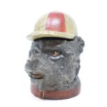 A painted bronze inkwell, in the form of a bear wearing a jockey cap, 11 cm high Report by RB Modern