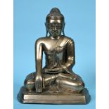 A Burmese brass Buddha, seated, 38 cm high See inside front cover colour illustration Report by GH