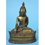 A Burmese bronze Buddha, seated, wearing monastic robes, 17 cm high See illustration Report by RB