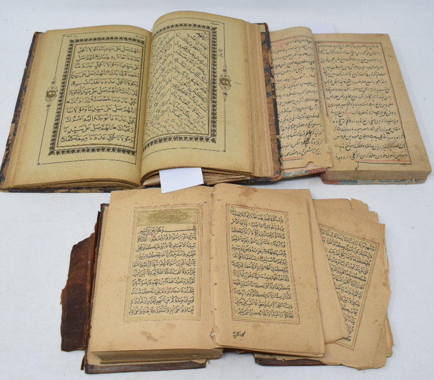 A Mughal book, bound in leather, binding poor, pages loose, and two other Mughal volumes (sold