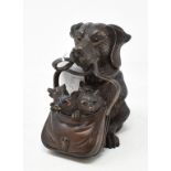 A carved wood inkwell, in the form of a dog with a satchel of puppies, 12.5 cm high Report by RB