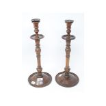 A pair of carved and turned wood candlesticks, 43 cm high (2)