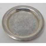 An Egyptian silver coloured metal dish, with engraved and calligraphy decoration, 15.5 cm diameter